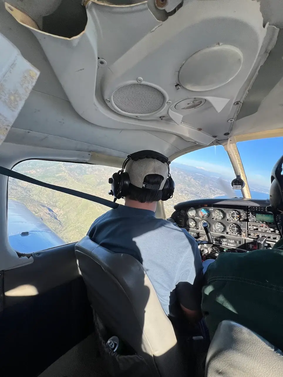 Students at Essence Flight School in Van Nuys Airport learning to fly in a Piper Archer cockpit